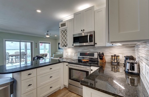 Navarre Beach House | “Semi-Retired”-Elevator-Pier-200+ 5 Star Reviews-Toys-Golf Cart Rental -EV Charg