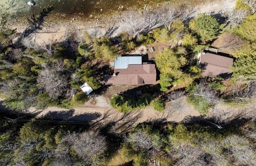 Charlevoix Cabin | Serene Lakeside Cottage with Stunning Sunsets, Just Minutes from Charlevoix!