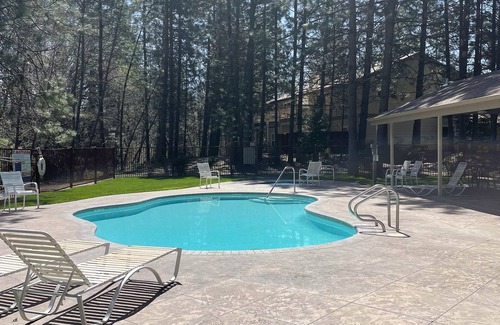 Bass Lake House | Serene river & mountain view retreat with hot tub, pool, AC, & patio