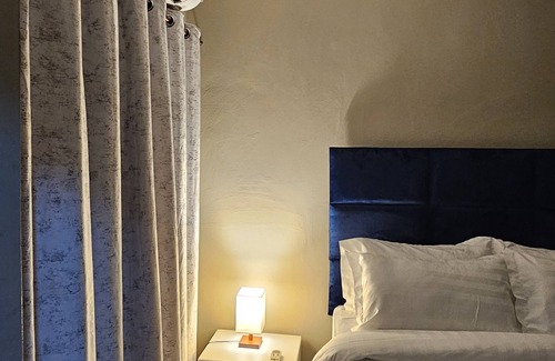 Gaborone Bed & Breakfast | Shiloh Inn-Tranquil midnight blue accent walls set relaxation tone for your stay