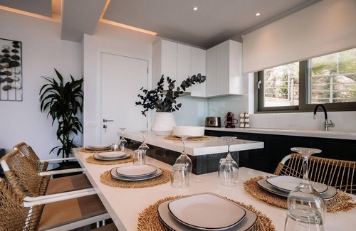 Agios Sostis House | Situated in an enviable beachside location, overlooking the picturesque fishing harbour of Agios Sos