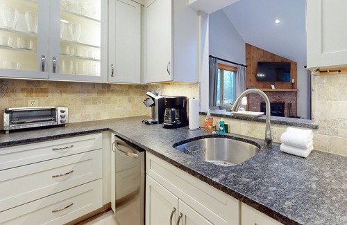 Ludlow Condo | Ski-in/out condo with water & mountain views, private sauna & fireplace