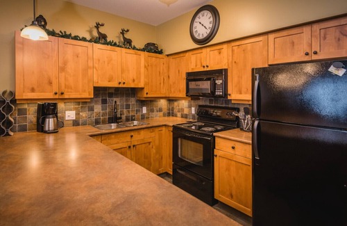 Sun Peaks Condo | Ski in Ski out condo with private Hot Tub backing on Golf course. 2 bed 2 bath.