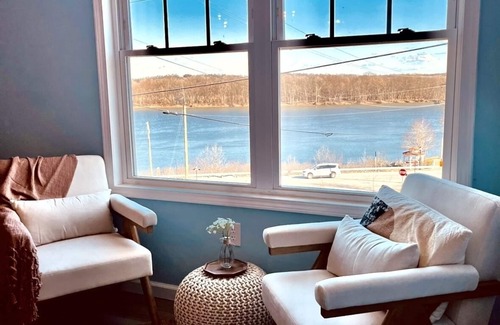 Aurora Condo | SKY Parlor sunrise and sunset views overlooking the river