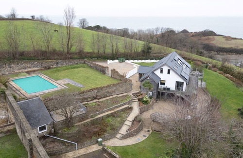 Watermouth House | Sleeps 12, swimming pool, sea views, games rooms