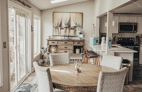 Portage Lakes Cottage | SLICE OF HEAVEN lake front cottage with HOTTUB, fire pit, kayaks & Dog friendly!