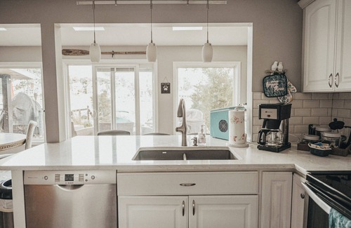 Portage Lakes Cottage | SLICE OF HEAVEN lake front cottage with HOTTUB, fire pit, kayaks & Dog friendly!