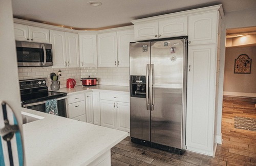 Portage Lakes Cottage | SLICE OF HEAVEN lake front cottage with HOTTUB, fire pit, kayaks & Dog friendly!