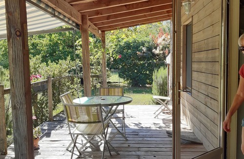 Issigeac House | Small detached wooden house in well-maintained fenced park.