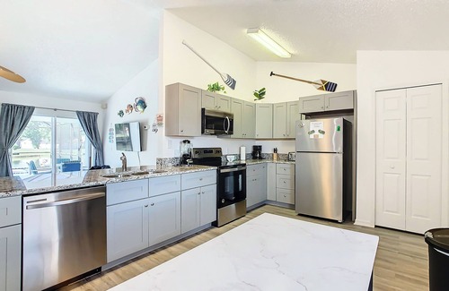 Crescent Lakes House | Smiling Disney Oasis heated pool home in Kissimmee with Game room.