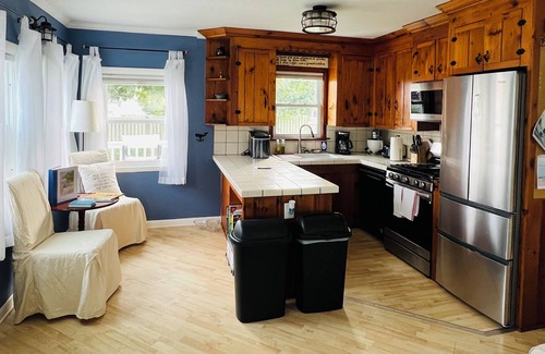 Snug Harbor Cottage | Soak in enchanting water views. Fully-fenced yard for family and pets!