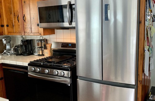 Snug Harbor Cottage | Soak in enchanting water views. Fully-fenced yard for family and pets!