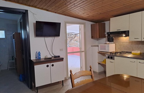 Solanas Apartment | Solanas, large double room with sea and beach views