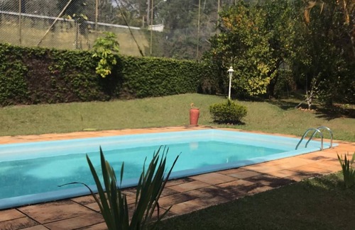 Caiocara Ski Chalet | Soothing chalet with swimming pool, soccer field, lake, and WiFi in Atibaia