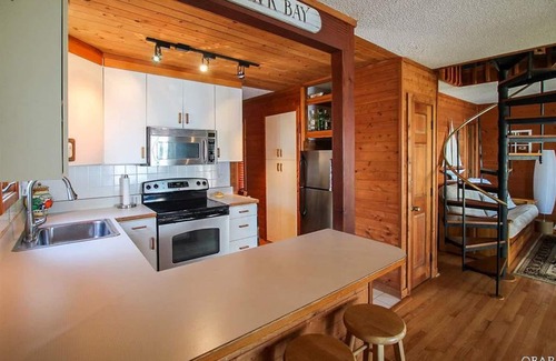 Colington Harbour Cottage | Soundfront Beach House with Kayaks, Sailboat & lots of Beach Toys!