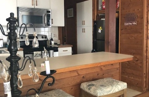 Colington Harbour Cottage | Soundfront Beach House with Kayaks, Sailboat & lots of Beach Toys!