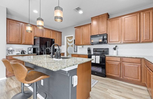Hutto House | Spacious 4-bedroom Round Rock home with an open floor plan, Smart TVs in every room, and high-speed internet. Pet-friendly and conveniently close to Kalahari Resort and Dell Diamond, this modern yet cozy retreat is perfect for families & long stays.