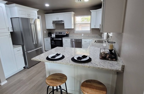 Guthrie House | Spacious 5-bedroom house with covered parking and private backyard in Guthrie.