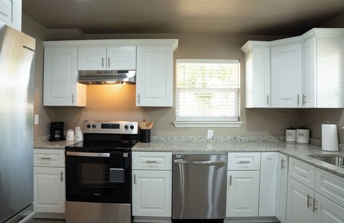 Guthrie House | Spacious 5-bedroom house with covered parking and private backyard in Guthrie.