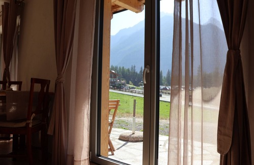 Bionaz Apartment | Spacious and bright studio apartment with large windows and a beautiful view of the mountains.
