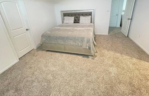 Hockley House | Spacious bedroom with private bathroom and walk in closet inside a quiet house.
