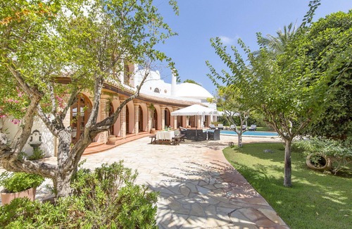 Santa Eulalia del Rio Villa | Spacious villa with a beautiful garden, private pool on the beach of Cala Llenya