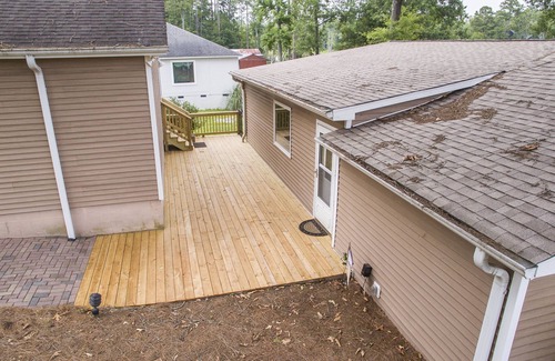 Prosperity House | Spacious grounds and home with large deck and dock in quiet cove.