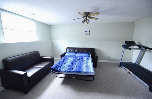 Amherstview House | Spacious Hearth Escape with Natural Light & fireplace