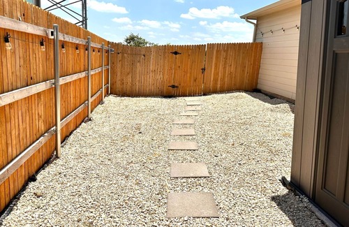 Buda House | Spacious home near Austin with a large backyard perfect for enjoying sunsets.
