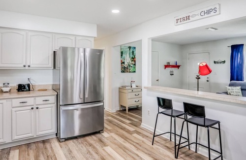 Highland House | Spacious home with water view, dock, lovely patio, central AC & washer/dryer