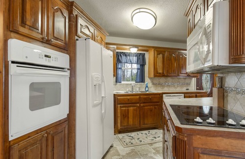 Pryor House | Spectacular lake view with a huge deck and a Hot Tub.