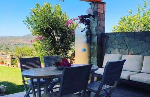 Chia Villa | Spectacular sea view of the entire bay of Su Giudeu. King size bed +topper