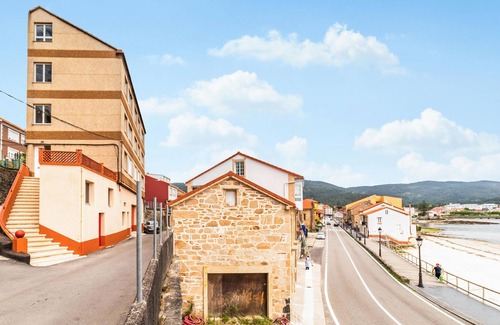 Muros Apartment | Spend a wonderful vacation in this inviting apartment by the sea.