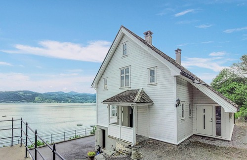 Oystese House | Spend an unforgettable vacation by the fjord in this comfortable vacation home.