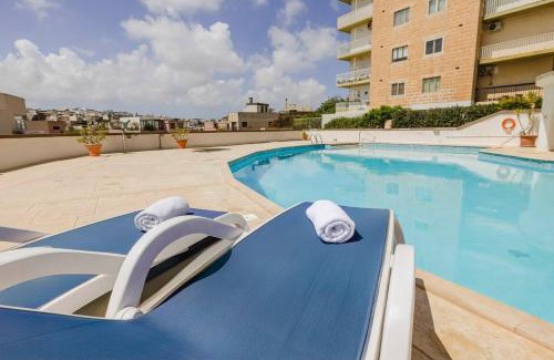 Swieqi Apartment | Spinola Court 2bed W Pool And Parking By Homely