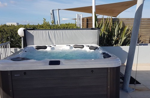 The Entrance Apartment | Spiral staircase to 2 level rooftop Penthouse with Hot spa & BBQS