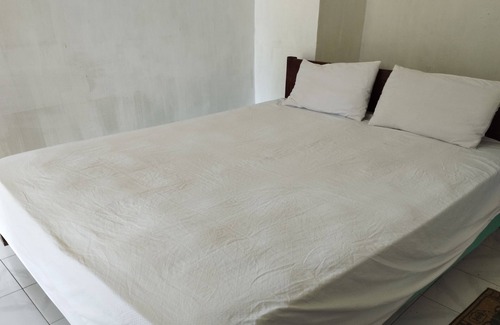 Mangsit Hotel | SPOT ON 93740 Madame Guesthouse
