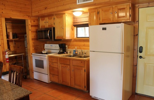 Leakey Cabin | Springs Cabin located near the pool area.