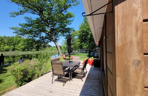 Campbellford Cottage | Start each morning on the porch with warm sunshine and beautiful waterfront view