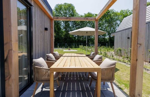 Oude-Tonge House | Stay in comfort in this modern, recently built holiday home with a beautiful view of the water from
