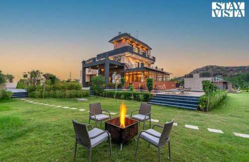 Gurugram Villa | StayVista's Shivoham Farms - Mountain-View Villa with Outdoor Pool, Lawn, and Terrace