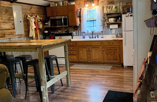 Cool Ridge Cabin | Step back in time with this unique cozy cabin by the creek.