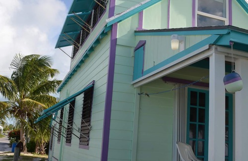 Spanish Wells House | Step from your porch onto the soft white sand & crystal clear water.