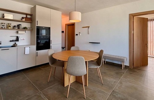 Mellieħa Heights Apartment | Step inside to discover a modern and elegantly decorated space, featuring two spacious bedrooms with ample storage, ensuring a restful and convenient stay. The open-plan living area boasts contemporary furnishings, providing a chic and cozy atmospher