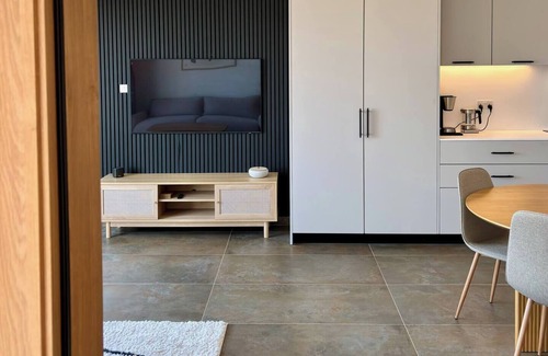 Mellieħa Heights Apartment | Step inside to discover a modern and elegantly decorated space, featuring two spacious bedrooms with ample storage, ensuring a restful and convenient stay. The open-plan living area boasts contemporary furnishings, providing a chic and cozy atmospher
