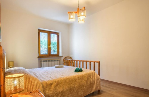 Arcidosso House | Step into a spacious cottage with tile floors and cozy corners where you can retreat.