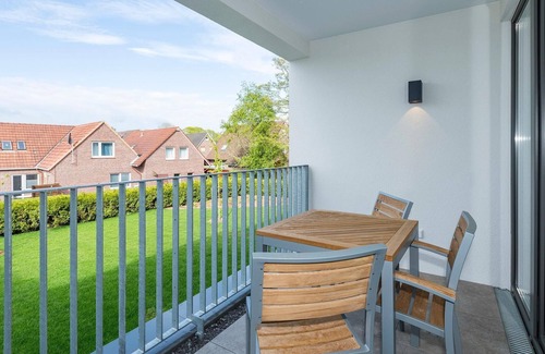 Bensersiel Apartment | Strandnahes 1-zimmer Apartment mit Balkon, Parkplatz, Schwimmbad- & Saunanutzung