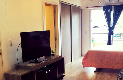 Comuna 12 Apartment | Studio apartment with garage and balcony overlooking the city