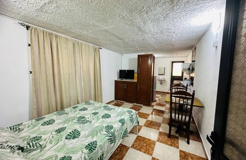 Candos Apartment | studio with 1 double bed, private bathroom with warm shower,free parking & wifi.