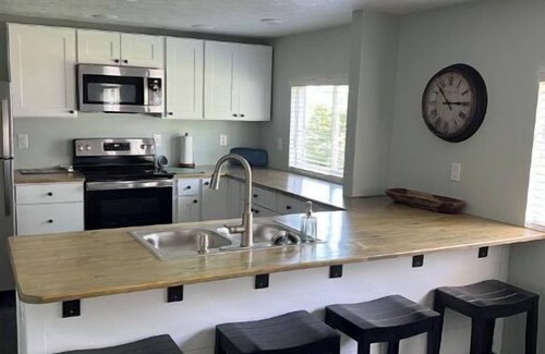 Suttons Bay House | STUNNING 100 FEET OF PRIVATE BEACH ON GRAND TRAVERSE BAY WITH HOT TUB
